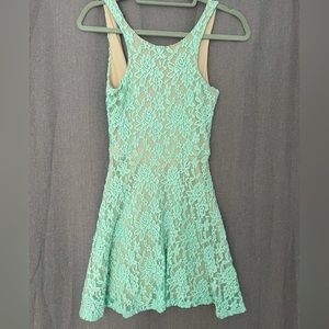 Teal lace overlaying nude lining mini dress small